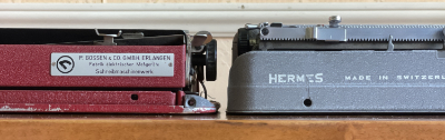 1950 Gossen Tippa and 1952 Hermes Baby typewriters rear views side-by-side